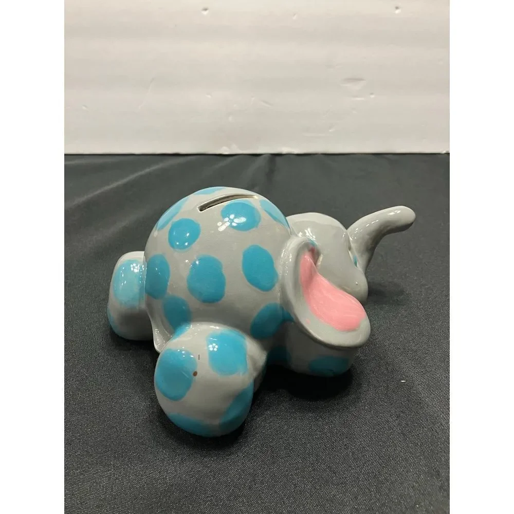 Vintage Elephant piggy bank. Gray with blue dots‎
